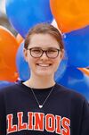 Smiling college student in glasses and Illinois t-shirt
